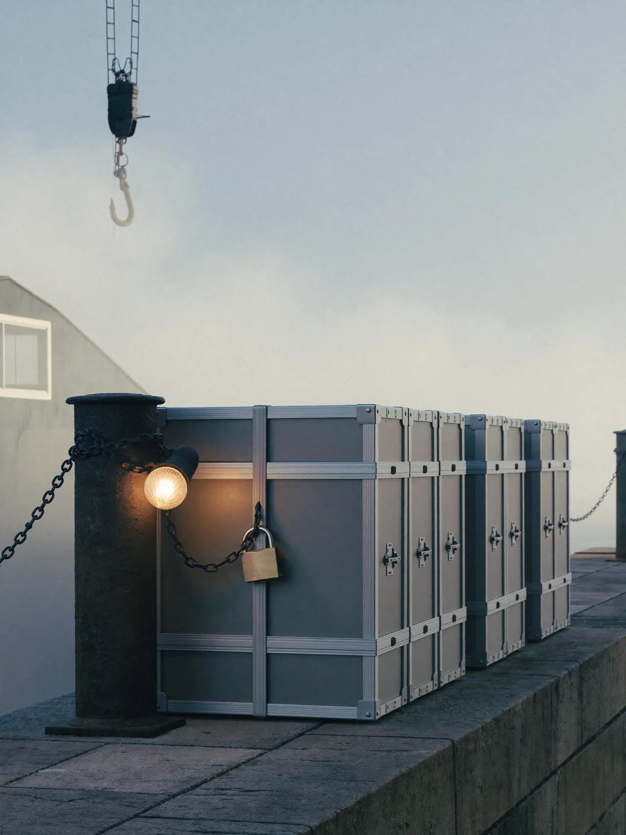 One crate is chained first; the rest wait behind it.